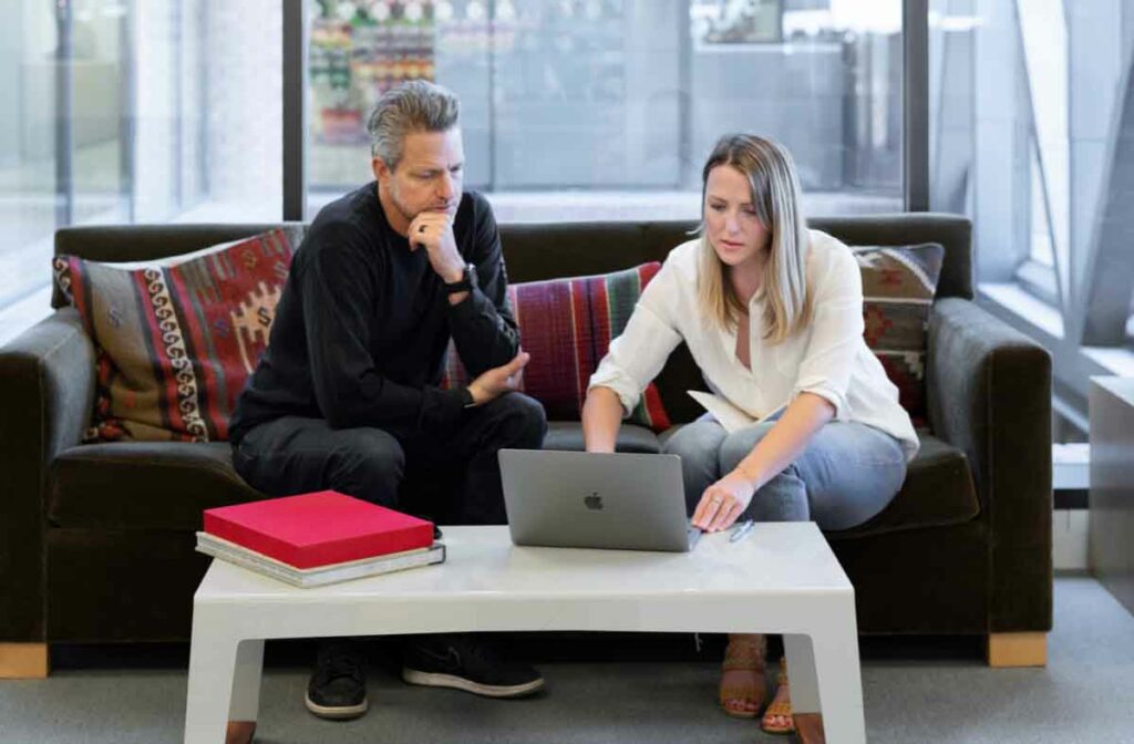 People talking at a computer