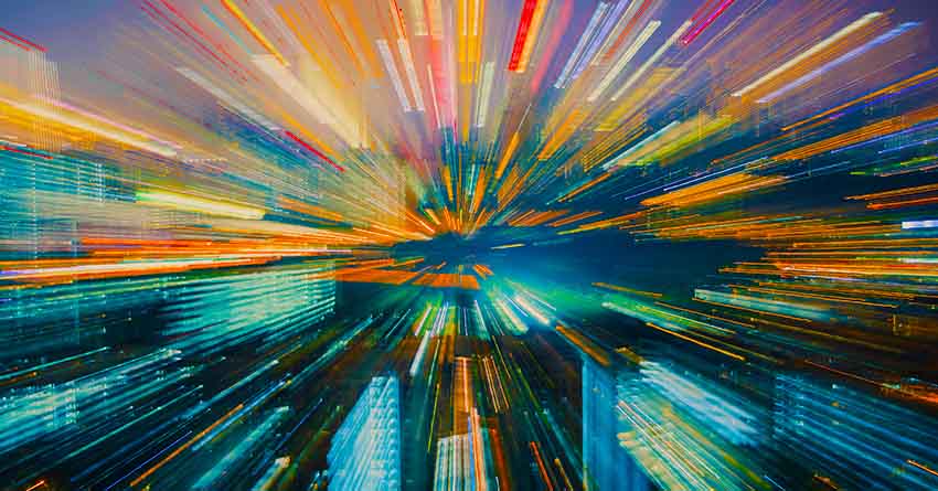 A colorful blurred image of a cityscape.